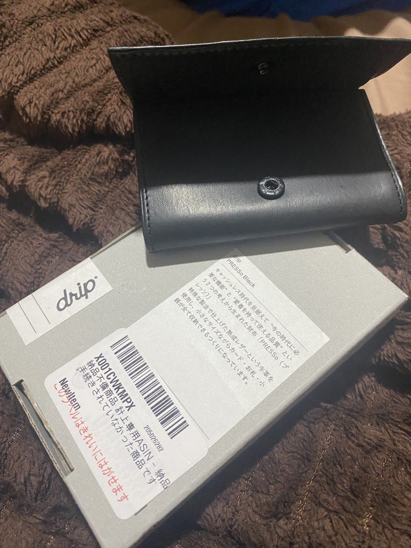drip PRESSo Black leather wallet (Category: Wallets & Card Holders) located in Manila. Submitted by cdb_22 (Listing ID 1466318485, Image 1). Description: Drip PRESSo wallet in black. Minimalist leather design made for cashless carry. Holds cards, cash, and coins securely with a snap button closure. Comes in the original packaging box with all original inserts and cards included..
