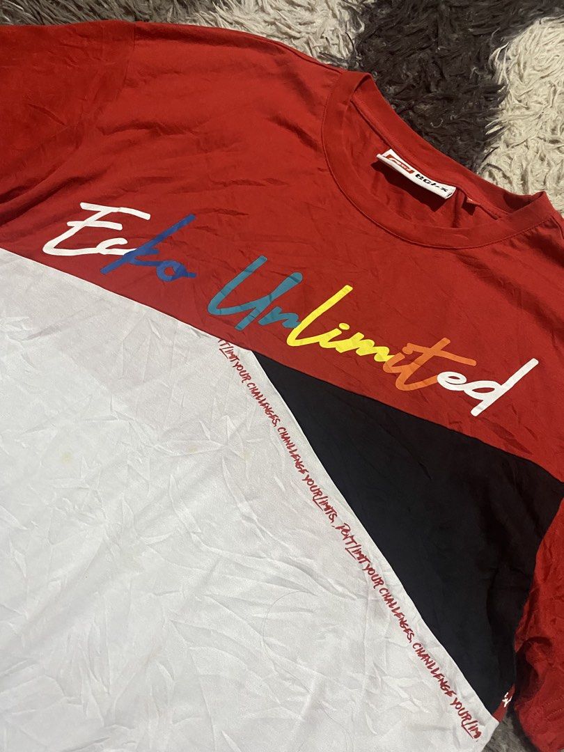 Ecko Unltd Colorblock Tee Red White Black (Category: Tshirts & Polo Shirts ) located in Caloocan City. Submitted by remythrift (Listing ID 1466278355, Image 2). Description: - Brand: Ecko Unltd - Style: Short sleeve colorblock t-shirt (Red, White, Black) - Size: Medium (170/92A) - Design: Large multicolored cursive Ecko Unltd chest text with small repeated text detail - Details: Branded neck label and small red tag near the hem - Condition: Excel