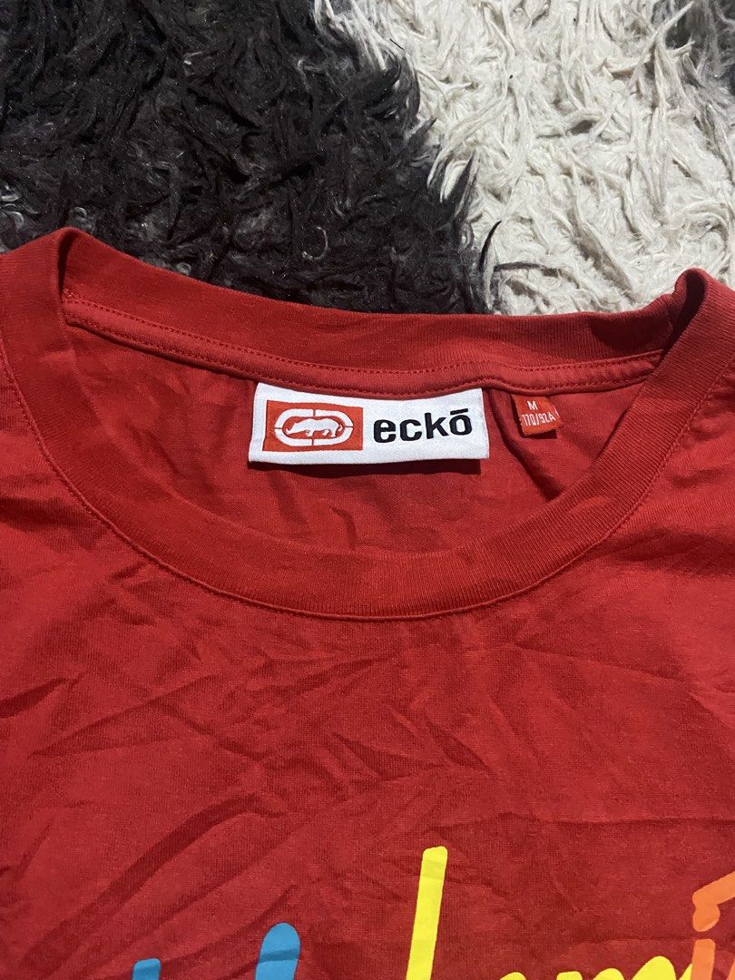 Ecko Unltd Colorblock Tee Red White Black (Category: Tshirts & Polo Shirts ) located in Caloocan City. Submitted by remythrift (Listing ID 1466278355, Image 3). Description: - Brand: Ecko Unltd - Style: Short sleeve colorblock t-shirt (Red, White, Black) - Size: Medium (170/92A) - Design: Large multicolored cursive Ecko Unltd chest text with small repeated text detail - Details: Branded neck label and small red tag near the hem - Condition: Excel