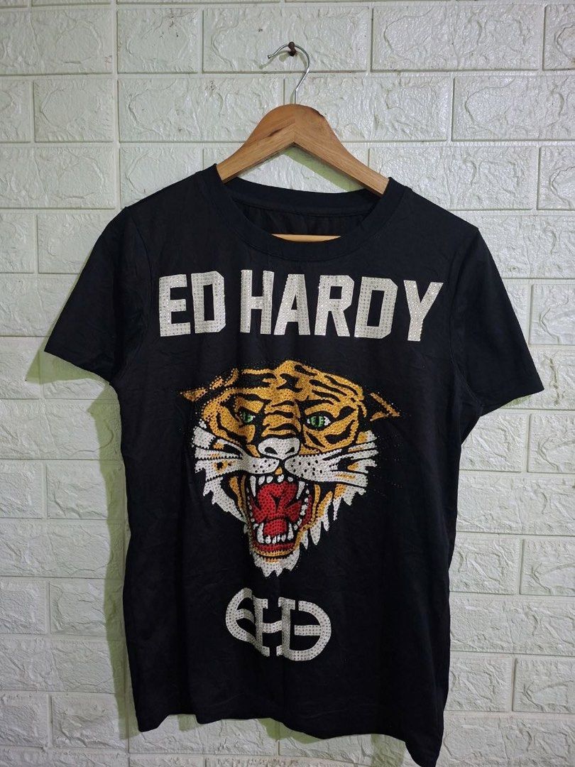 Ed Hardy Rhinestones Tiger Design (Category: Blouses) located in Bulacan. Submitted by bleue.finds (Listing ID 1466300008, Image 1). Description: Ed Hardy Rhinestones Tiger Design 18.5 - width 26 - length missing neck tag need wash no major issues good condition .