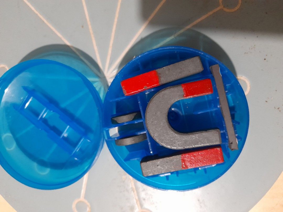 Educational Magnet Set (Category: Educational & Learning Toys) located in Bocaue. Submitted by marajapansurplus (Listing ID 1466174933, Image 1). Description: - Includes horseshoe magnet, bar magnets, ring magnets, and a small rectangular piece - All pieces clearly marked with North (N) and South (S) poles - Features bright red painted ends on several pieces - Comes in a convenient round blue plastic storage container with a fitted lid and organi