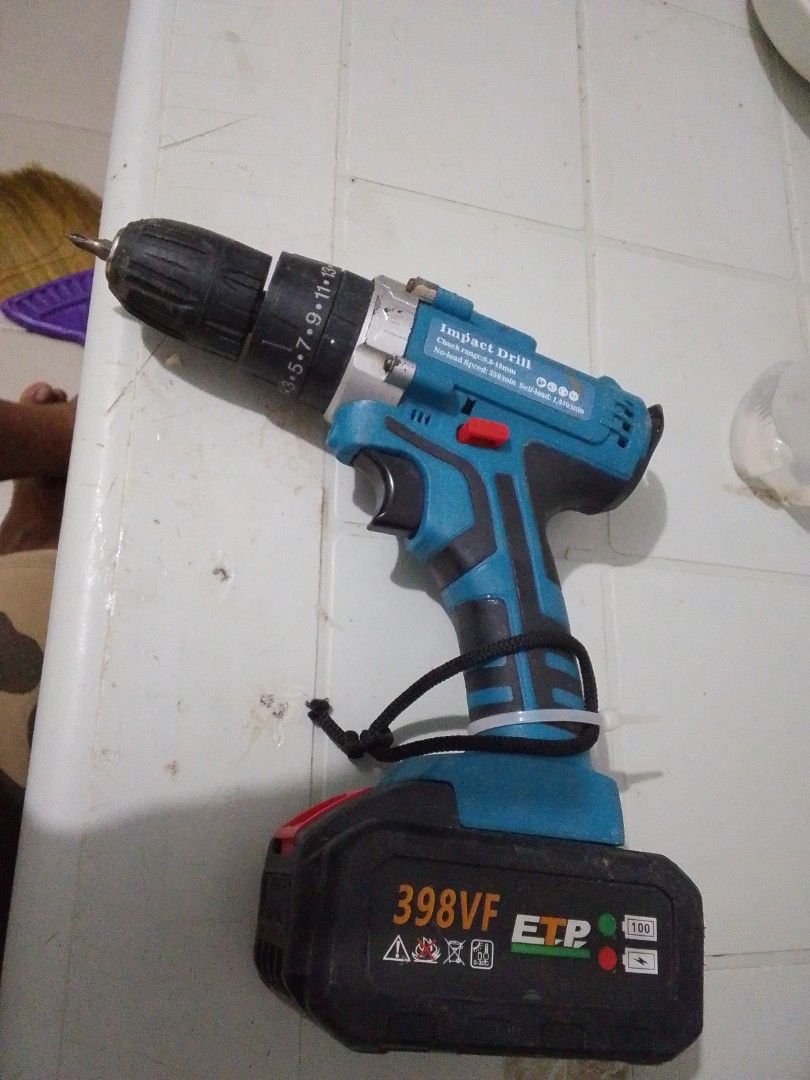 ETP 398VF Cordless Impact Drill (Category: Construction Tools & Equipment) located in Quezon City. Submitted by zealstone_baf57c (Listing ID 1466331781, Image 1). Description: - Brand/Model: ETP Cordless Impact Drill - Battery: 398VF with base gauge graphic - Chuck Range: 0.8-10mm bits - Speed: 350/min (no-load) up to 1,440/min (self-load) - Design: Blue and black body with handle tether loop - Condition: Minor workshop wear, fully tested and pow