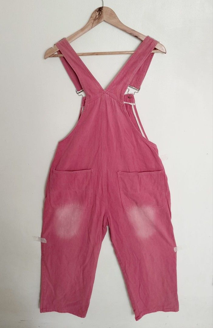 EVDR Pink Denim Overalls Something Good (Category: Jumpsuits) located in Bulacan. Submitted by clutsngo (Listing ID 1466185903, Image 2). Description: - Brand: EVDR - Color: Vibrant pink wash with intentional faded patches on knees and back - Material: Durable cotton with strong stitching - Details: 'Something Good' embroidered on the front bib pocket - Features: Classic adjustable straps, front and back pockets, and metal side button closures.