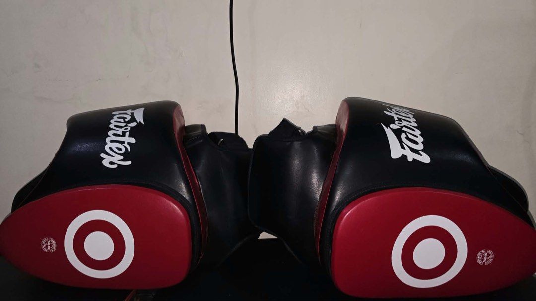 Fairtex Ultra Lite Thigh Pad TP5 (Black/Red) (Category: Combat Sports) located in Caloocan City. Submitted by yiyilittlethings (Listing ID 1466293996, Image 3). Description: Fairtex Ultra Lite Thigh Pad TP5 (Black/Red) Condition: Not used, new Original Price: 175 USD Price: 6k.