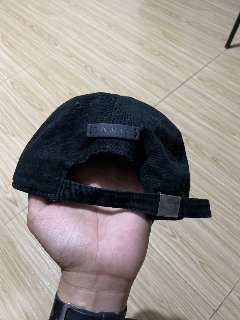 Fear of God Essentials 1977 Black Cap (Category: Caps & Hats) located in Davao. Submitted by jayelcarba61168 (Listing ID 1466314611, Image 2). Description: - Brand: Fear of God Essentials - Color: Black with white "1977" embroidery - Details: Essentials logo metal buckle, rubber label on the back - Fit: Adjustable strapback (one size fits most) - Condition: Brand new / Excellent quality - Style: Versatile streetwear staple, easy to match with dai