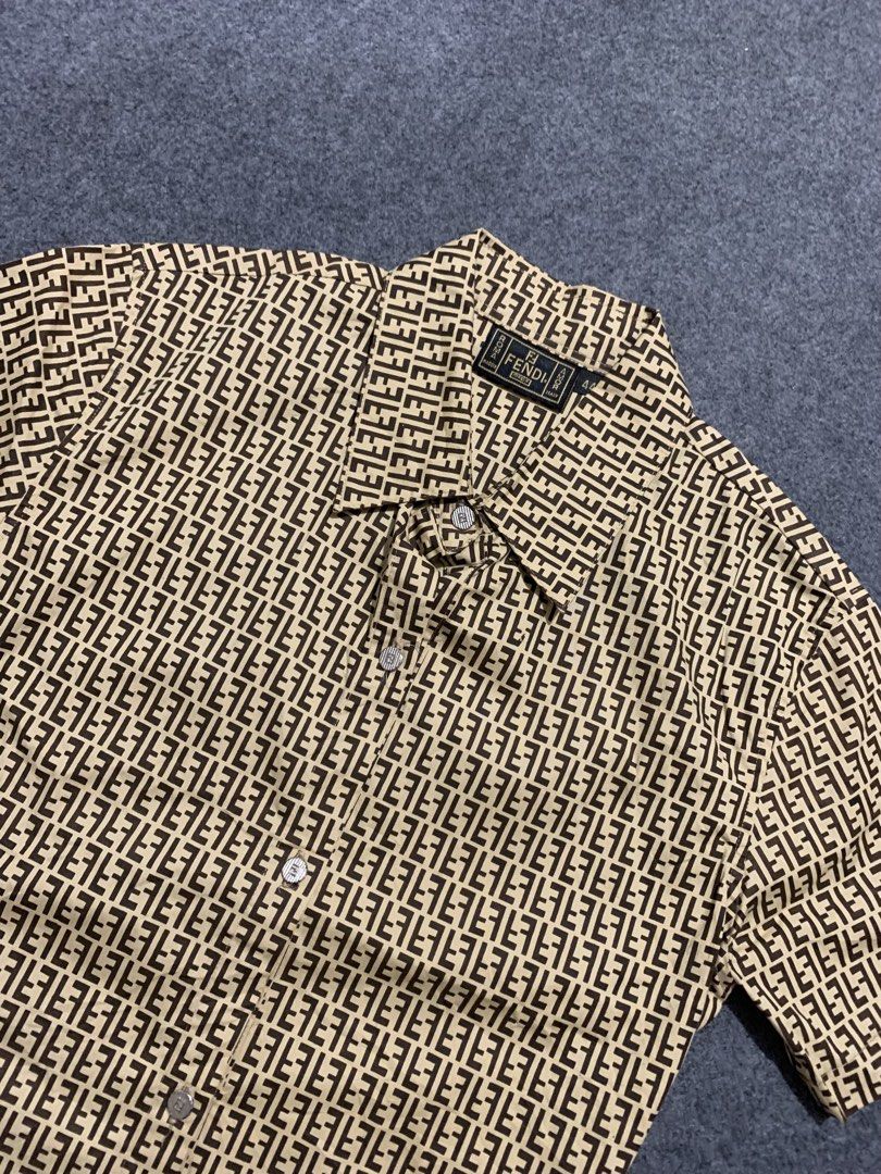 Fendi Monogram Short Sleeve Button-Up Shirt Size 44 (Category: Tshirts & Polo Shirts ) located in Cebu City. Submitted by ninyothrift (Listing ID 1466304299, Image 2). Description: - Brand: Fendi - Design: Iconic brown and beige FF monogram print - Style: Short sleeve button-up with classic collar and branded buttons - Size: Tagged Size 44 - Condition: Clean stitching, lightweight, and ready to wear - Fast shipping available across the Philippine