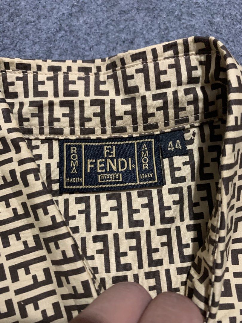 Fendi Monogram Short Sleeve Button-Up Shirt Size 44 (Category: Tshirts & Polo Shirts ) located in Cebu City. Submitted by ninyothrift (Listing ID 1466304299, Image 3). Description: - Brand: Fendi - Design: Iconic brown and beige FF monogram print - Style: Short sleeve button-up with classic collar and branded buttons - Size: Tagged Size 44 - Condition: Clean stitching, lightweight, and ready to wear - Fast shipping available across the Philippine