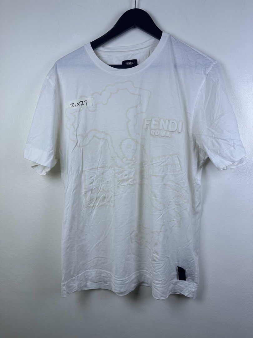Fendi Roma White T-Shirt (Category: Shirts) located in Manila. Submitted by declutterpromax (Listing ID 1466209968, Image 1). Description: - Fendi Roma T-Shirt, Made in Italy - Color: Crisp White - Design: Embossed Fendi Roma lettering with subtle graphic map details - Fit: Regular fit, short sleeves, crew neck - Condition: Clean, classic luxury piece.
