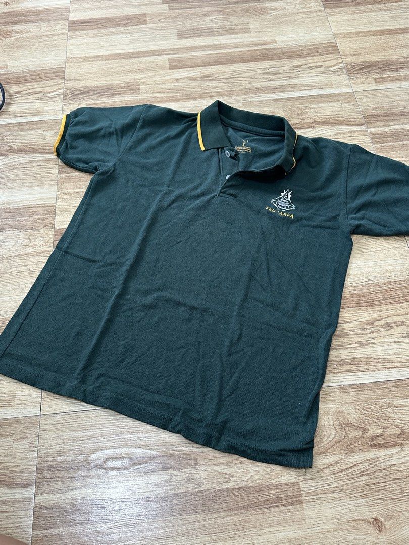 FEU IARFA Green Polo Shirt Size S (Category: Tshirts & Polo Shirts ) located in Manila. Submitted by allana18 (Listing ID 1466219511, Image 2). Description: - Brand: FEU IARFA - Color: Dark green with yellow piping details on collar and sleeves - Size: S - Material: Cotton-polyester blend - Features: Embroidered chest logo, two-button placket - Condition: Excellent, clean fabric with no obvious flaws.