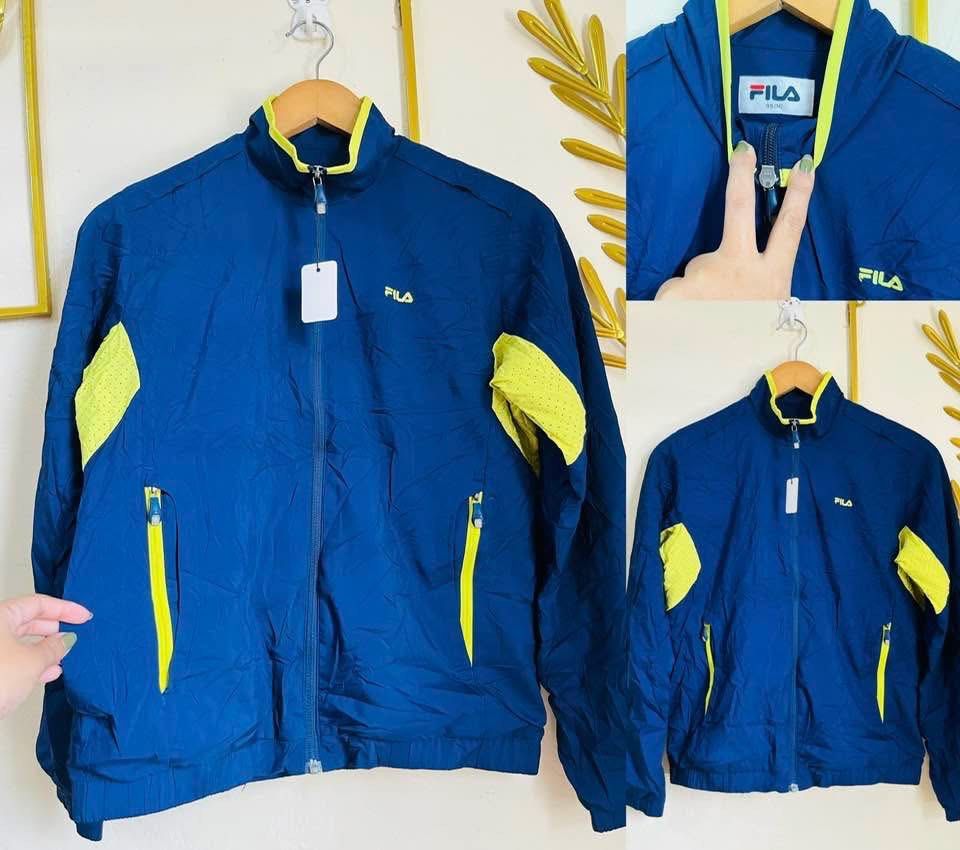 FILA Blue and Lime Green Windbreaker Jacket (Category: Coats, Jackets and Outerwear) located in Manila. Submitted by bengirlclothing (Listing ID 1466197771, Image 1). Description: - Brand: FILA - Color: Deep blue with bright lime green accents (collar, shoulders, zipper pockets) - Closure: Full zip front - Material: Lightweight - Best for: Runs, workouts, or casual outdoor days.