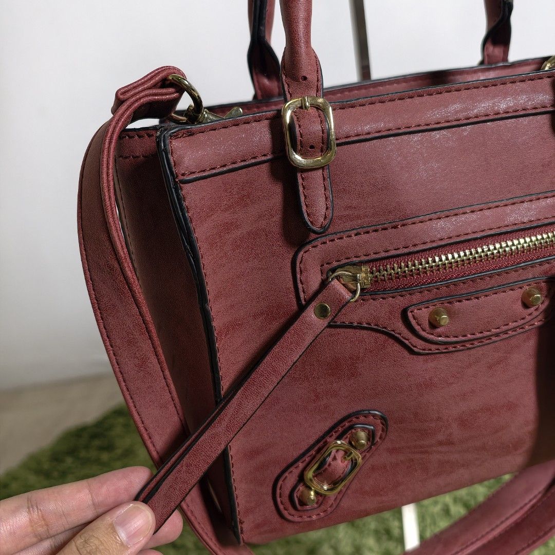 Firano Leather Hand Bag with Sling (Category: Cross-body Bags) located in Antipolo. Submitted by millennialthrifter (Listing ID 1466330616, Image 3). Description: 🍷 FIRANO WINE RED HAND BAG WITH SLING - 800 PESOS ✅Brand: Firano ✅Brand new condition 💛 ✅With original FIRANO tags ✅Handbag + sling ✅Color: Deep, muted red with burgundy/wine undertones ✅Multiple compartments ✅With gold tone hardwares.