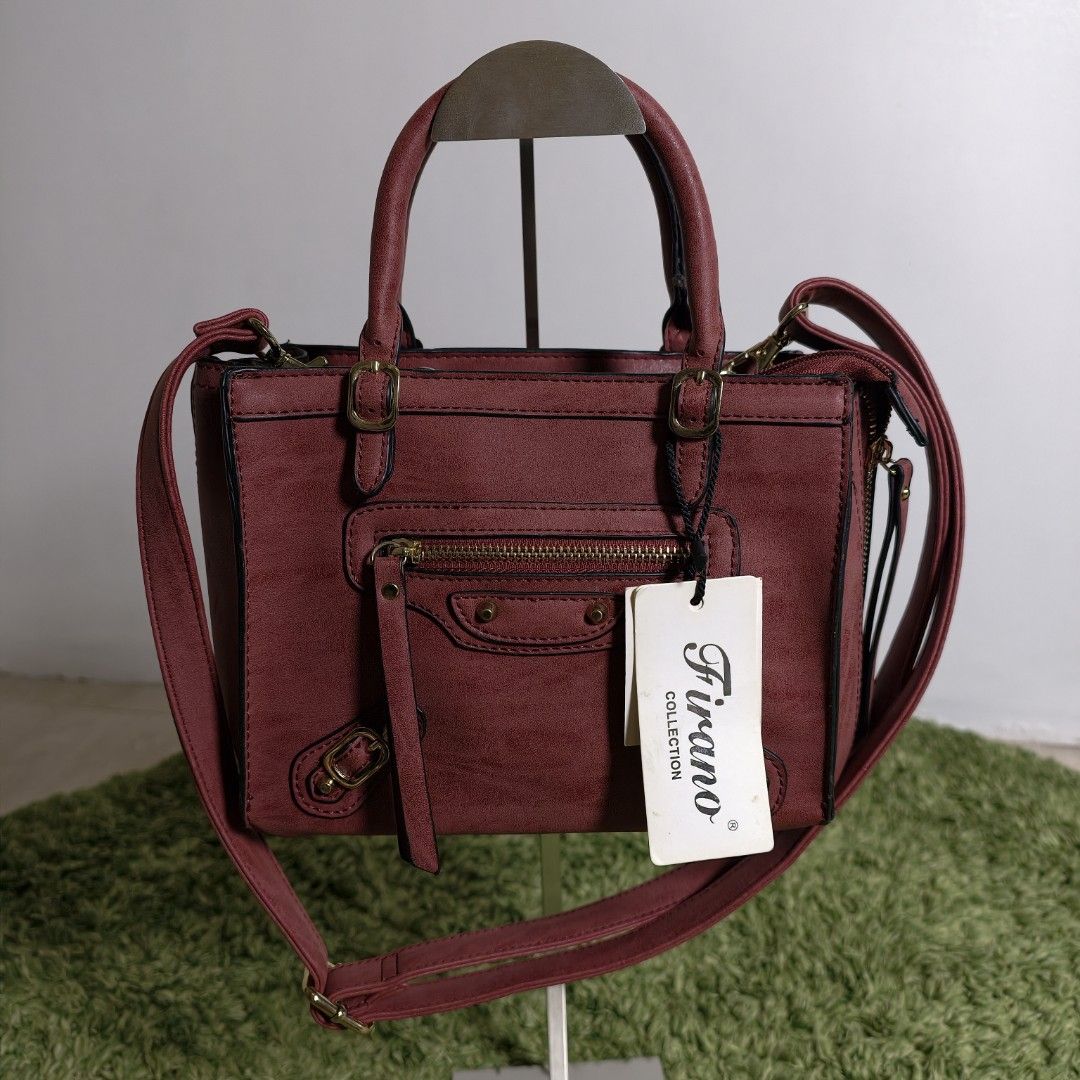 Firano Leather Hand Bag with Sling (Category: Cross-body Bags) located in Antipolo. Submitted by millennialthrifter (Listing ID 1466330616, Image 2). Description: 🍷 FIRANO WINE RED HAND BAG WITH SLING - 800 PESOS ✅Brand: Firano ✅Brand new condition 💛 ✅With original FIRANO tags ✅Handbag + sling ✅Color: Deep, muted red with burgundy/wine undertones ✅Multiple compartments ✅With gold tone hardwares.