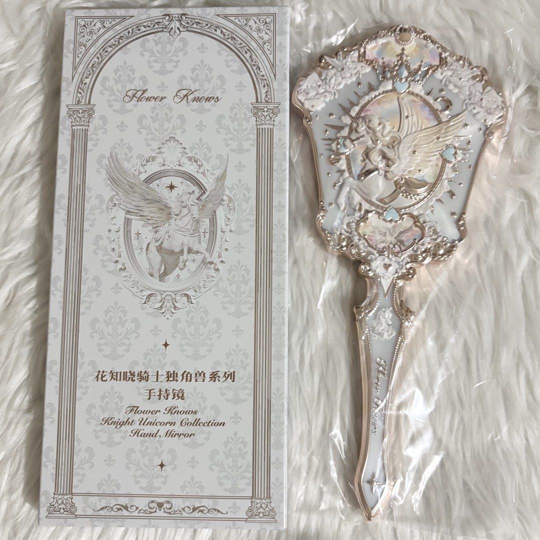 Flower Knows Knight Unicorn Hand Mirror (Cloud White) (Category: Makeup) located in Cavite. Submitted by 3yaaa018 (Listing ID 1466240662, Image 1). Description: Flower Knows Knight Unicorn Hand Mirror (Cloud White) - ₱900 - brand new, never been used (on hand - below srp) - authentic flower knows, includes original box - protective plastic film is still attached to the mirror and has never been removed - can send more photos and details upon requ