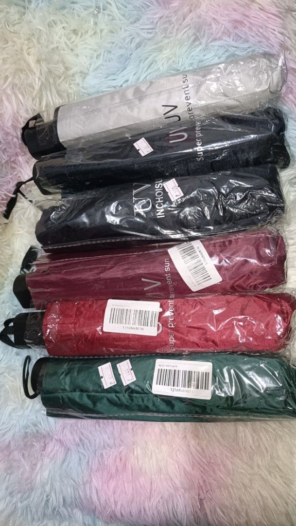 Foldable UV Protection Sun Umbrellas Multiple Colors Available (Category: Umbrellas) located in Agdangan. Submitted by strawberryvanilla9 (Listing ID 1466176646, Image 1). Description: - Brand new compact foldable umbrellas - Available colors: Grey, Black, Maroon, Red, and Dark Green - Condition: Sealed in original plastic packaging with barcodes and price tags - Portable and handy size, easy to fit in bags - Perfect protection for unexpected rai