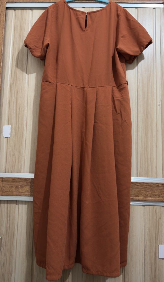ForMe Rust Orange Pleated Midi Dress Size Large (Category: Dresses) located in Manila. Submitted by annesrack (Listing ID 1466281938, Image 3). Description: - Brand: Forme - Color: Rust Orange - Size: Large - Sleeves: Short with elastic cuffs - Closure: Back neckline button - Design: Pleated skirt from waist down - Material: Soft and comfortable - Versatility: Perfect for casual outings or office wear.