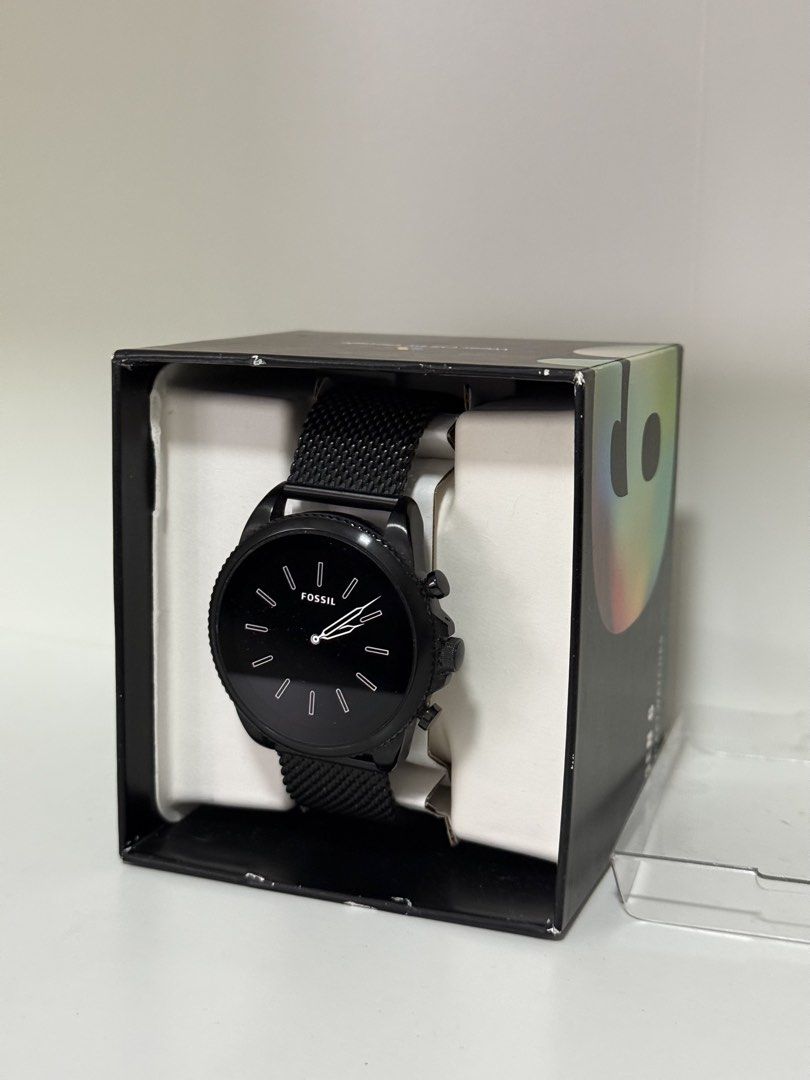 Fossil Gen 6 Smartwatch Black Mesh Strap DW13F2 (Category: Wearables & Smart Watches) located in Pasig City. Submitted by eiramcat01 (Listing ID 1466244539, Image 2). Description: - Brand: Fossil Smartwatch - Color: All-black case with matching black mesh metal strap - Display: Digital display inside a classic round dial - Features: Built-in heart rate sensor and 3-button navigation - Strap: Standard quick-release pins for easy strap swapping - I