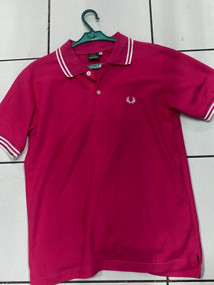 Fred Perry Polo Shirt Pink Size M (Category: Tshirts & Polo Shirts ) located in Manila. Submitted by ariane0422 (Listing ID 1466257993, Image 1). Description: - Brand: Fred Perry - Item: Polo Shirt - Color: Pink with white tipping on collar and cuffs - Size: Medium (M) - Details: Classic button placket, straight hem, clean fabric - Branding: Embroidered laurel wreath logo on chest - Condition: Excellent, clean and well-maintained.