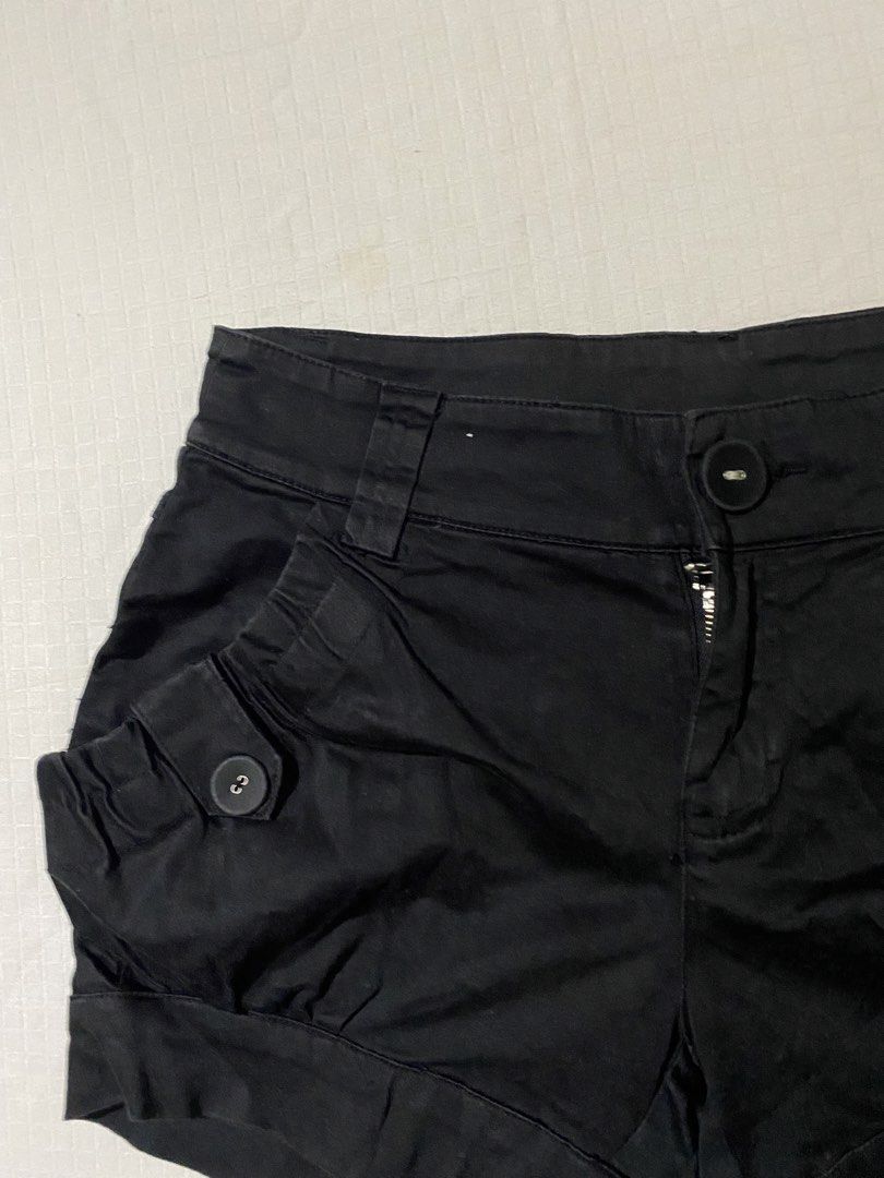 FREE! Black shorts with button pockets (Category: Shorts) located in Quezon City. Submitted by getitrightaway.ph (Listing ID 1466261925, Image 2). Description: FREE IF U BUY 2 OR MORE FROM MY LISTING - Color: Black - Material: Comfortable cotton - Fit: Mid-rise with a structured balloon silhouette - Details: Rolled cuffs, front button closure, zip fly, and belt loops - Pockets: Stylish side pockets with decorative buttons - Condition: Dark fabric