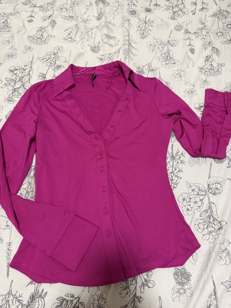 Fuchsia pink long sleeve button down collared shirt (Category: Longsleeves) located in Las Pinas. Submitted by tuasonaria85497 (Listing ID 1466284634, Image 1). Description: - Color: Fuchsia pink - Fit: Fitted cut through the body - Details: Sharp collar, front button closure, long sleeves with button cuffs - Style: Bold statement top, versatile for office wear or nights out.