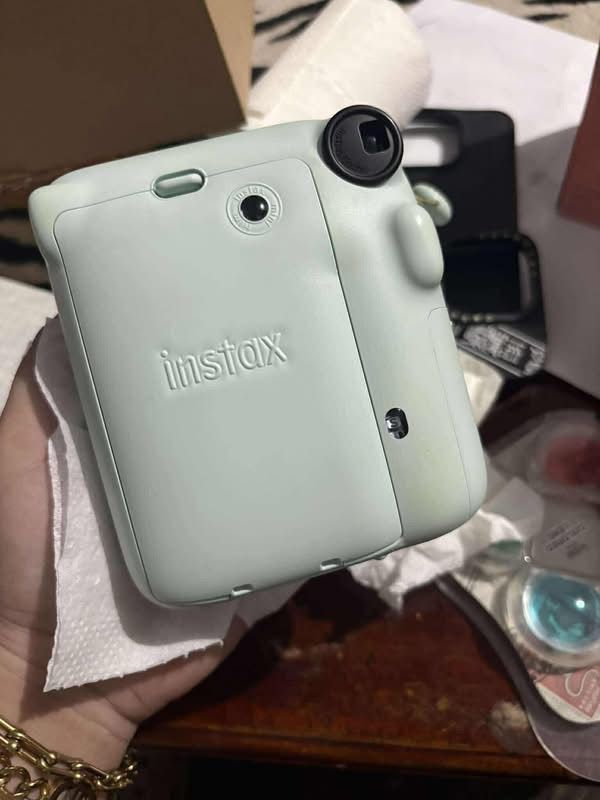 Fujifilm Instax Mini 12 Pastel Blue Bundle With Accessories (Category: Cameras) located in Roxas City. Submitted by trixxxxxxx (Listing ID 1466260632, Image 2). Description: - Authentic Fujifilm Instax Mini 12 in Pastel Blue - Complete bundle: includes matching hand strap - Includes 4-filter colored lens set for creative shots - Comes with assorted decorative patches and stickers - Includes a photo-replaceable storage frame - Fully functional, te