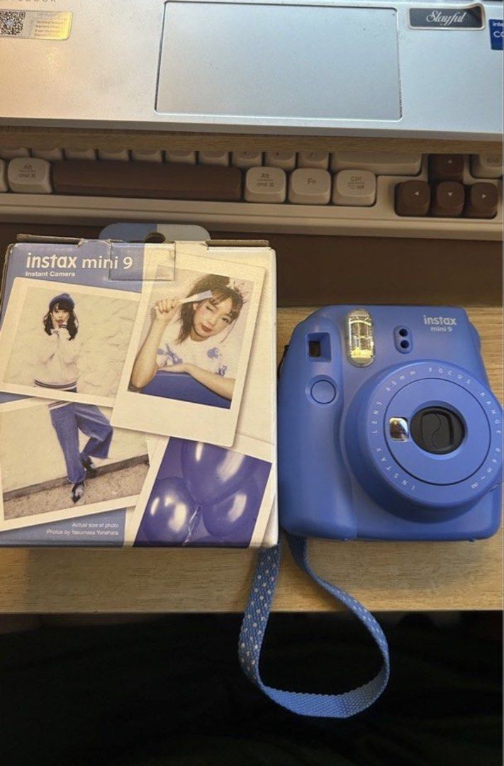 Fujifilm Instax Mini 9 Cobalt Blue Instant Camera (Category: Cameras) located in Manila. Submitted by jhajhanebi20703 (Listing ID 1466311655, Image 2). Description: - Model: Fujifilm Instax Mini 9 (Cobalt Blue) - Condition: Tested and working perfectly - Battery compartment: Clean and functional with easy-to-remove door - Film: Uses standard Instax Mini instant film - Inclusions: Original box and matching strap - Perfect for: Parties, hangouts, a