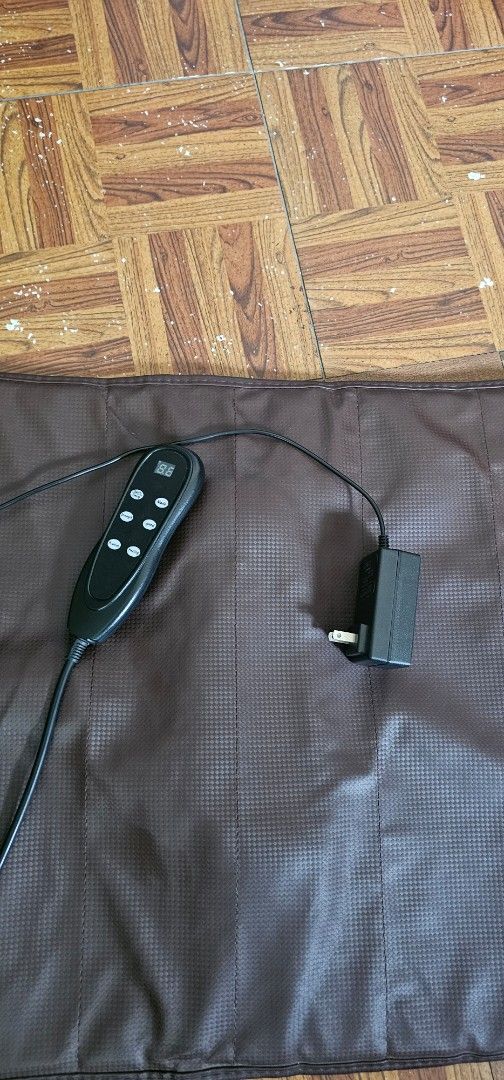 Full Body Massage Mat with Wired Remote and Pillow (Category: Massage Devices) located in Manila. Submitted by anthonylee23810 (Listing ID 1466298078, Image 2). Description: - Brown full body massage mat with separate matching pillow - Wired handheld controller for easy operation - Multiple vibration intensity settings and soothing heat options - Plugs directly into standard wall outlets (adapter included) - Ideal for back pain relief, relaxation