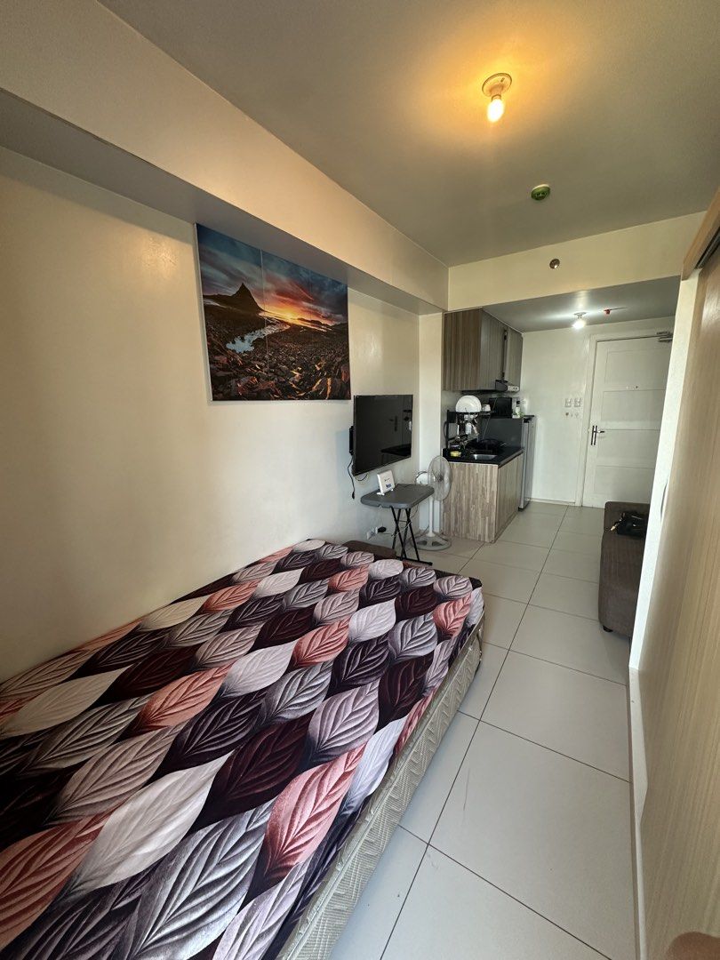 Fully Furnished Studio Condo Unit with Pool Access (Category: Shelves, Cabinets & Racks) located in Manila. Submitted by iamjuliewoo (Listing ID 1466167614, Image 2). Description: -Circulo Verde Condo 25sqm with balcony - Fully furnished studio unit, ready for immediate move-in - Living & Sleeping: Comfortable double bed, sofa, wardrobe, aircon, TV, and dining area - Kitchen: Equipped with built-in cabinets, sink, range hood, electric stove, micr