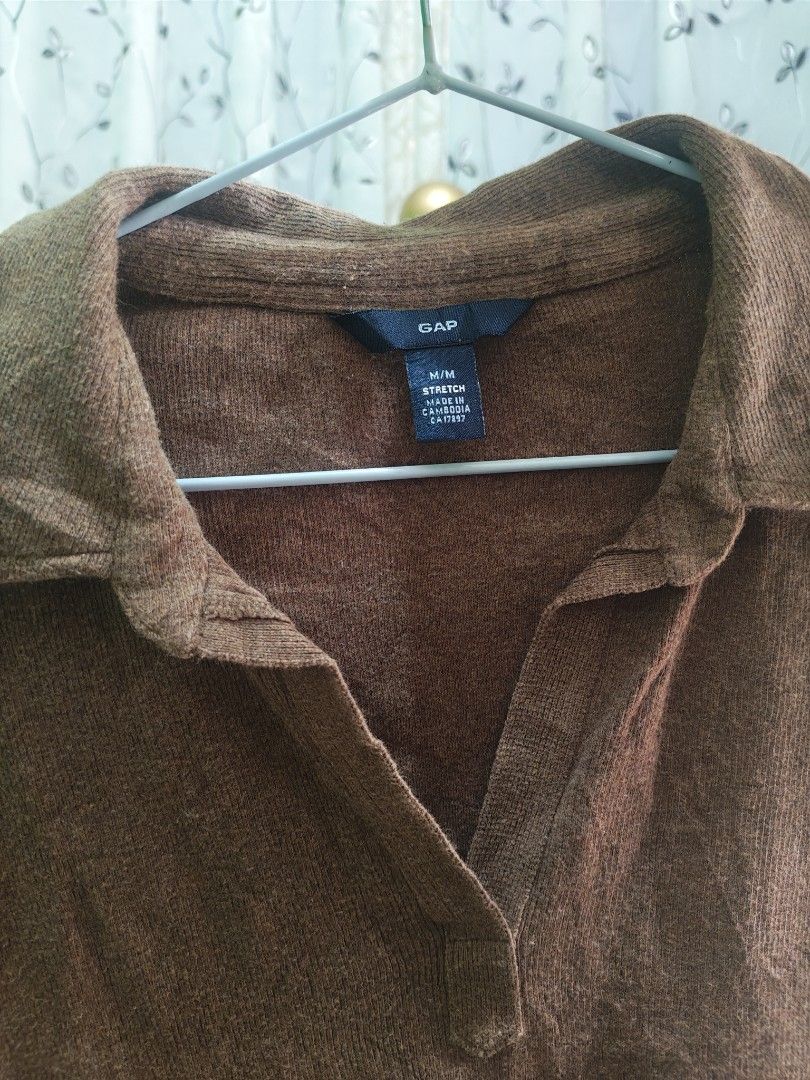 GAP Brown Collared Long Sleeve Knit Top M (Category: Longsleeves) located in Caloocan City. Submitted by _misskaye (Listing ID 1466160865, Image 3). Description: - Brand: Gap - Color: Brown - Size: M (tag intact) - Style: Stretch knit top with classic collar and V-neckline - Fit: Fitted silhouette with long sleeves - Origin: Made in Cambodia - Condition: Excellent, ready to wear!.