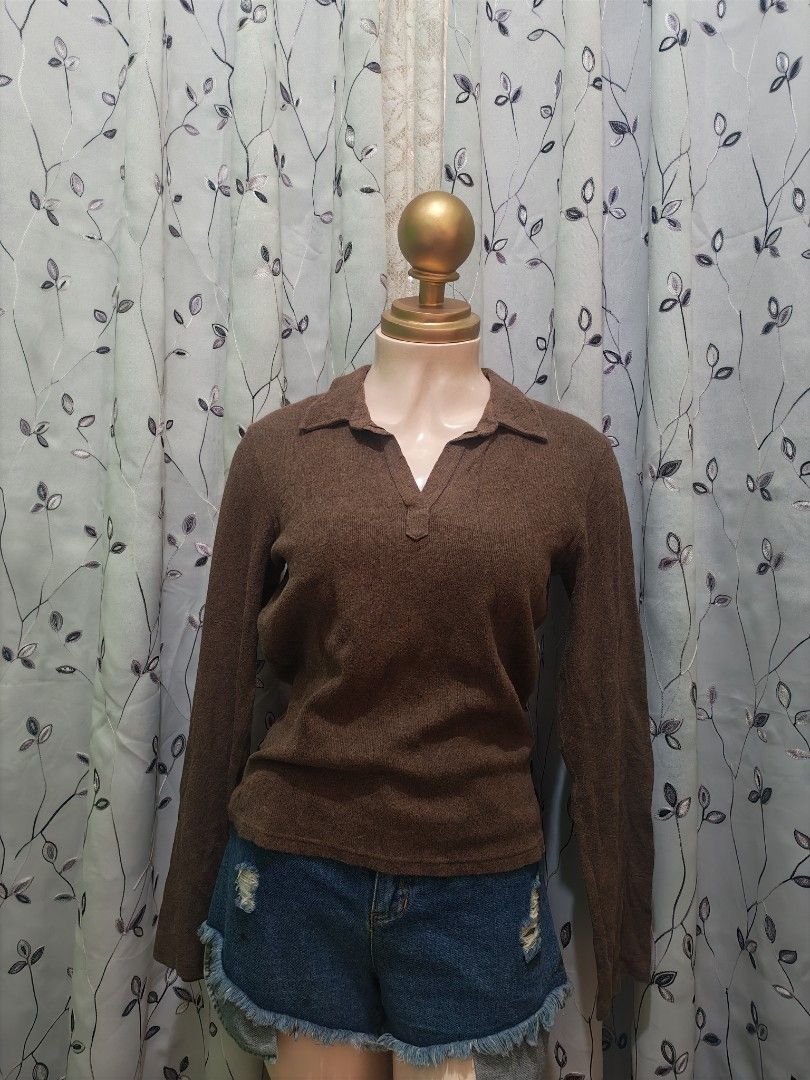 GAP Brown Collared Long Sleeve Knit Top M (Category: Longsleeves) located in Caloocan City. Submitted by _misskaye (Listing ID 1466160865, Image 2). Description: - Brand: Gap - Color: Brown - Size: M (tag intact) - Style: Stretch knit top with classic collar and V-neckline - Fit: Fitted silhouette with long sleeves - Origin: Made in Cambodia - Condition: Excellent, ready to wear!.