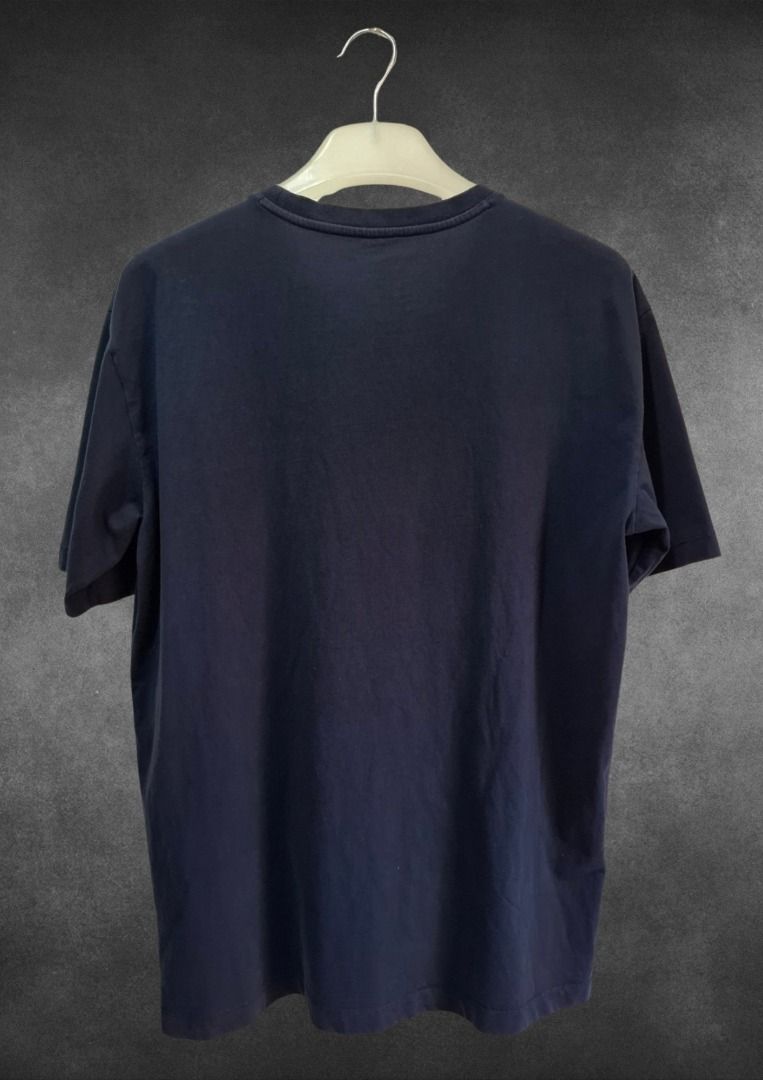 GAP Navy Blue Logo T-Shirt (Category: Tshirts & Polo Shirts ) located in Bulacan. Submitted by kei.collections (Listing ID 1466312465, Image 2). Description: - Brand: GAP - Color: Dark blue with light blue graphic print -Color Rate: 9.5//10 - Size: US L/G/EG - Material: 100% cotton (machine washable) - Fit: Short sleeves, crew neck - Condition: 10/10 - Issue: None - Mode of Payment: GCash - Shipping: via J&T Express (Metro Manila & Provincial).