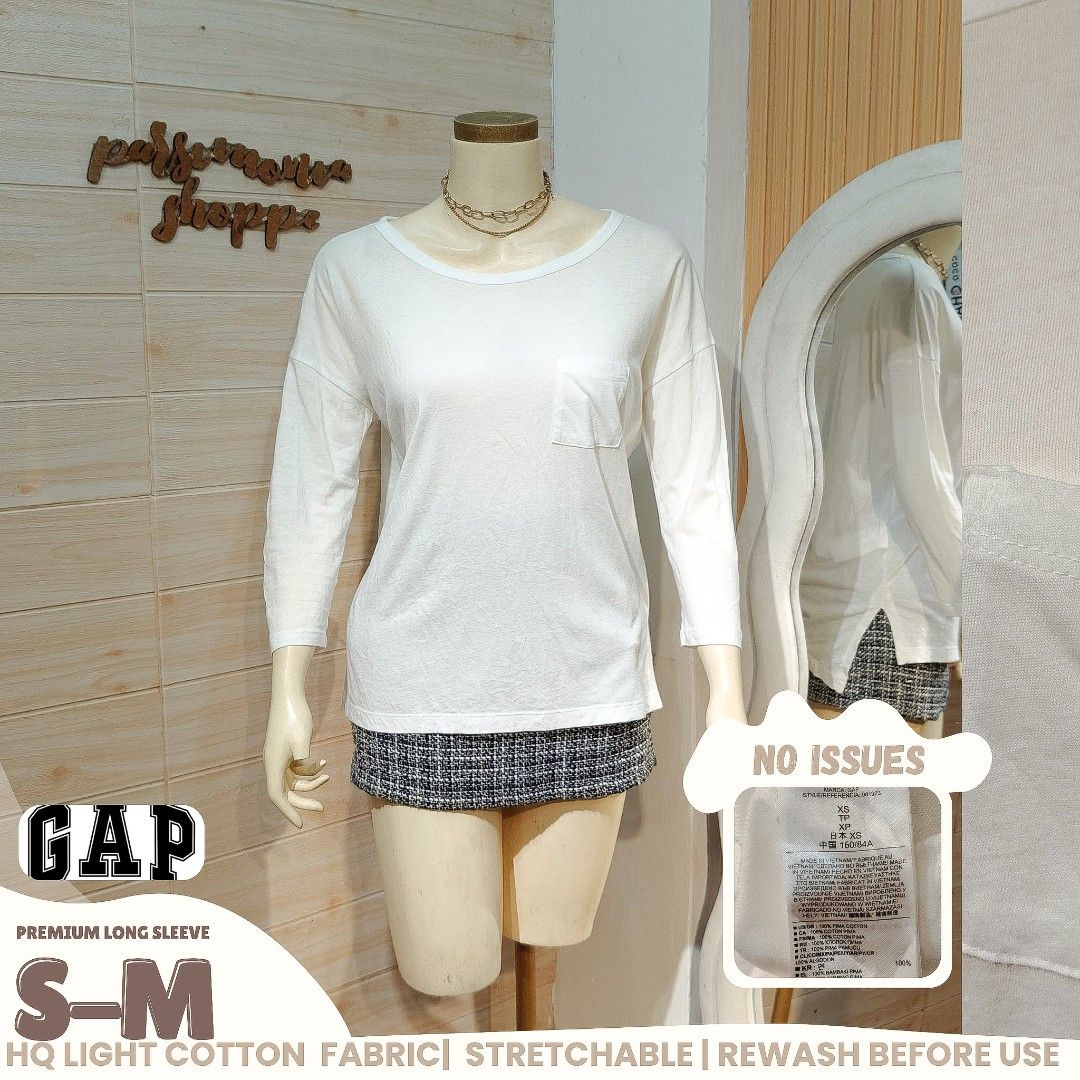 GAP Premium Long Sleeve White Top Size S-M (Category: Longsleeves) located in Bulacan. Submitted by alyssarys (Listing ID 1466329104, Image 1). Description: - Brand: GAP - Color: White - Size: Tagged XS, fits S to M comfortably - Material: Lightweight, stretchy cotton - Features: Scoop neck and small chest pocket - Condition: Great, no flaws detected - Style: Versatile basic piece, perfect for layering or everyday wear.