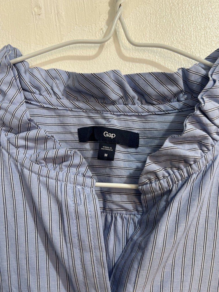 Gap stripes buttons down polo blouse (Category: Blouses) located in Las Pinas. Submitted by gaeley (Listing ID 1466165675, Image 2). Description: super pretty size M on tag b: 19" armpit to armpit l: 23" shoulder : 15" armhole: 10".
