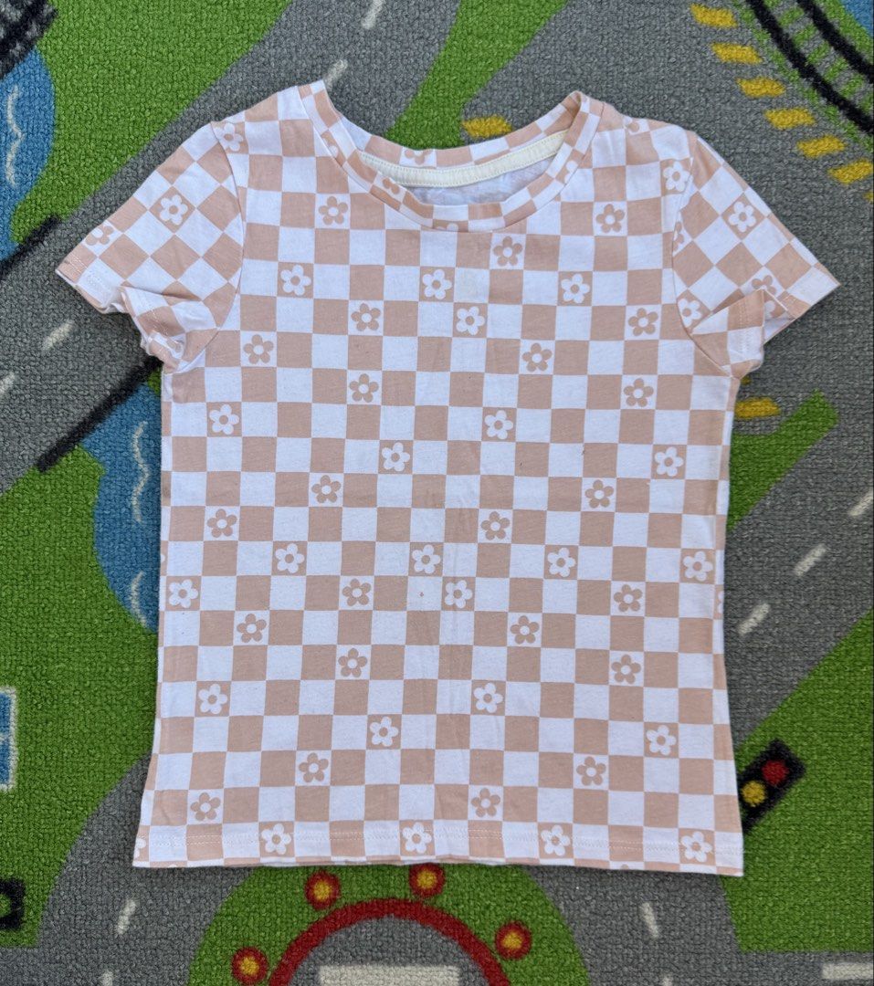 Garanimals Checkerboard Shirt (Category: Babies & Kids Fashion) located in Rizal. Submitted by preloovved (Listing ID 1466272323, Image 1). Description: Super cute pink and white checkerboard cropped tee with adorable daisy graphics. Made from soft, stretchy cotton for an easy, true-to-size everyday fit. Perfect for casual wear! Preloved, 4yo Meet-up only in GB1 San Mateo, Rizal Shipping fee c/o buyer. Tres Marias or J&T express Payment to be sen
