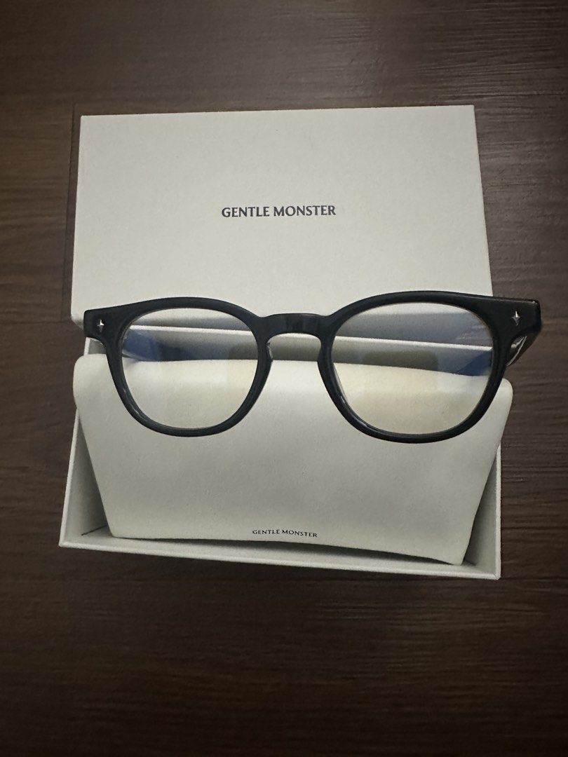 Gentle Monster Black Optical Frames with Case (Category: Vision Care) located in Quezon City. Submitted by heiressofpersia80 (Listing ID 1466202314, Image 2). Description: - Brand: Gentle Monster - Color: Classic Black - Material: Premium thick acetate - Style: Rounded silhouette, versatile everyday optical frames - Condition: Brand new, unworn, kept in original packaging - Inclusions: Original white hard case and branded outer presentation box.