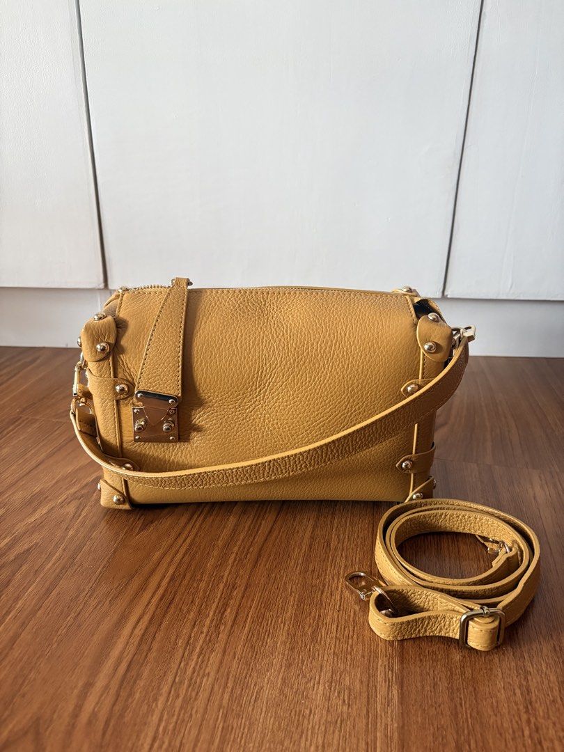 Genuine Leather (Category: Cross-body Bags) located in Paranaque City. Submitted by krystelmay_williams (Listing ID 1466196074, Image 1). Description: Genuine Leather - Yellow with Gold Studs Original Price: 6,000 Made in ITALY No Issue Rating: 10/10 ⭐️.
