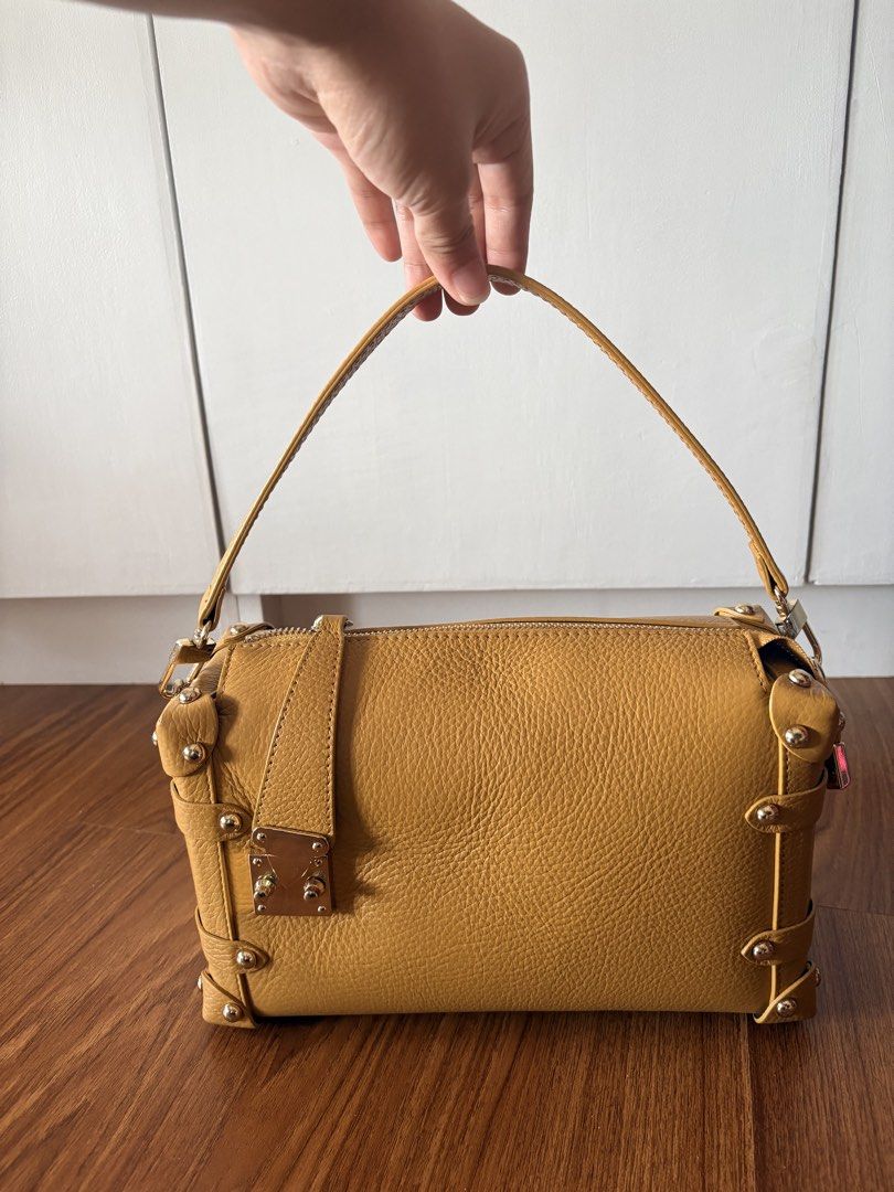 Genuine Leather (Category: Cross-body Bags) located in Paranaque City. Submitted by krystelmay_williams (Listing ID 1466196074, Image 2). Description: Genuine Leather - Yellow with Gold Studs Original Price: 6,000 Made in ITALY No Issue Rating: 10/10 ⭐️.