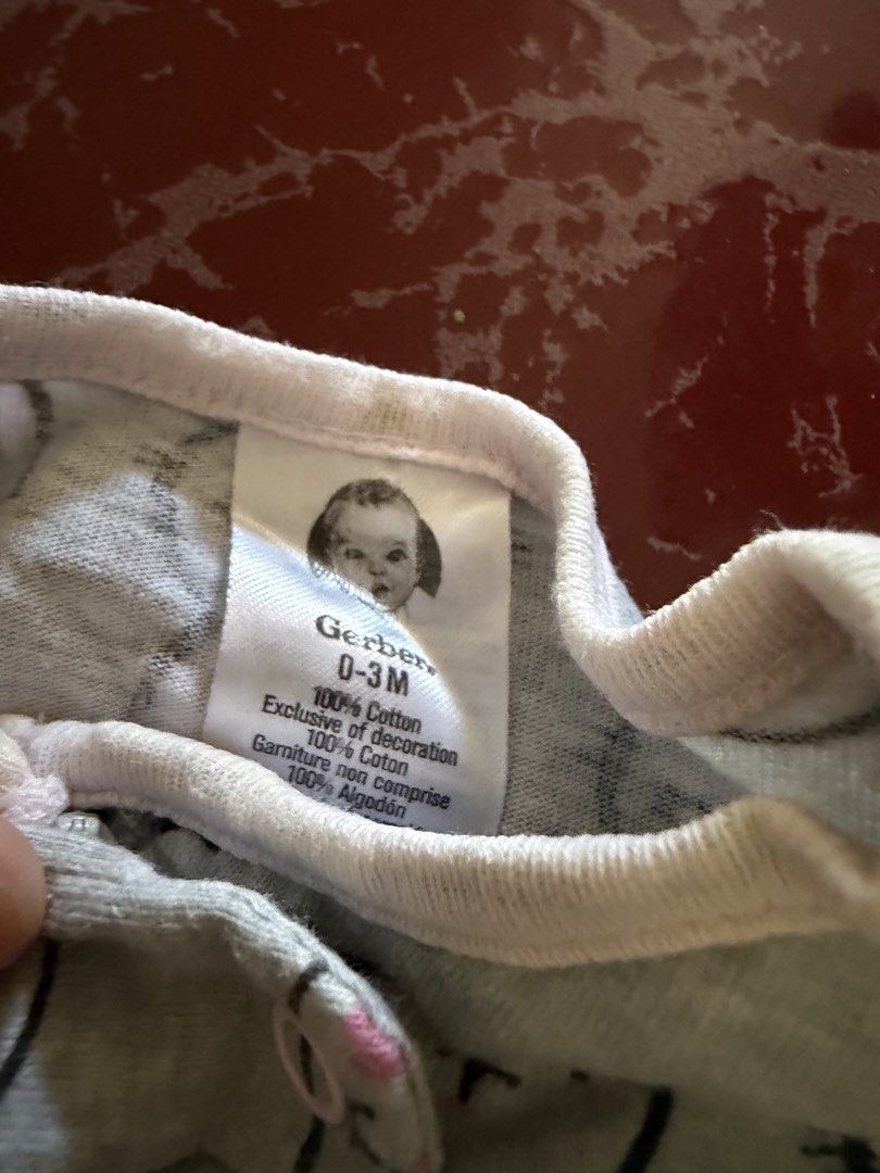 Gerber Baby Bunny Footed Sleeper 0-3M (Category: Babies & Kids Fashion) located in Las Pinas. Submitted by piwiealcantara (Listing ID 1466182044, Image 2). Description: - Brand: Gerber - Size: 0-3 Months - Color/Design: Light grey with all-over bunny rabbit pattern - Details: Pink embroidered "LOVE" patch on the chest - Comfort: 100% soft and breathable cotton - Features: Full zip front for easy changing and built-in footies to keep toes warm - C