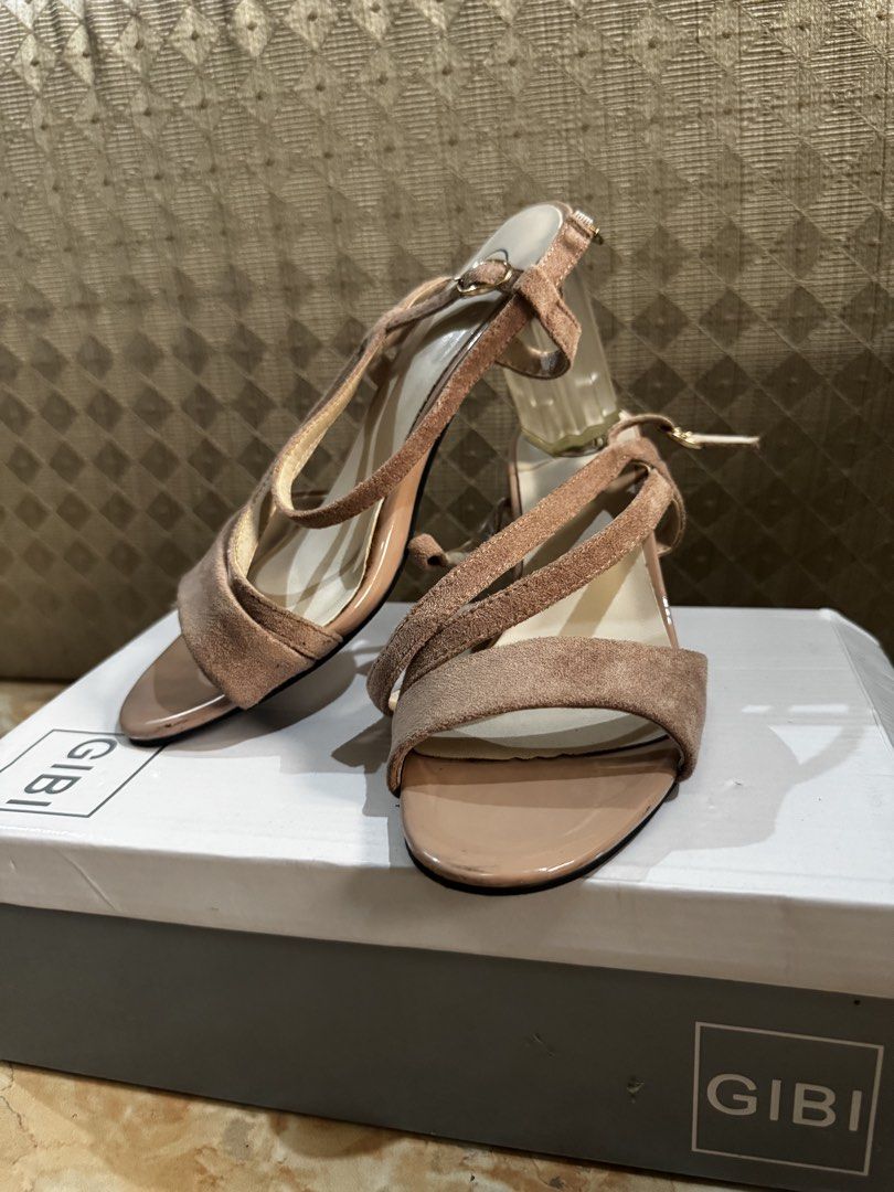 Gibi Nude Strappy Heels with Clear Block Heel (Category: Heels) located in Bacolod City. Submitted by lovedandprelovedbygee (Listing ID 1466166421, Image 3). Description: - Brand: Gibi - Color: Nude - Heel: Trendy clear block design - Material: Soft suede-texture straps across the front and ankle - Closure: Side buckle for a secure fit - Packaging: Comes in original Gibi shoebox - Condition: Excellent / Ready to wear.