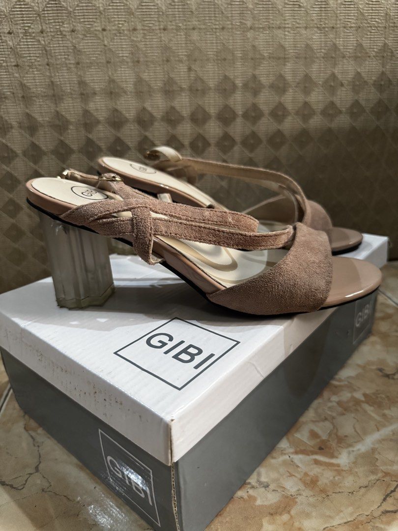 Gibi Nude Strappy Heels with Clear Block Heel (Category: Heels) located in Bacolod City. Submitted by lovedandprelovedbygee (Listing ID 1466166421, Image 2). Description: - Brand: Gibi - Color: Nude - Heel: Trendy clear block design - Material: Soft suede-texture straps across the front and ankle - Closure: Side buckle for a secure fit - Packaging: Comes in original Gibi shoebox - Condition: Excellent / Ready to wear.