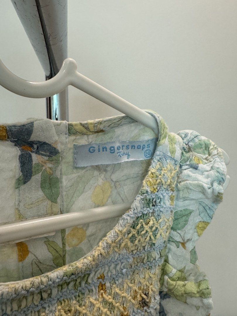Gingersnaps Tiny Floral Dress Size 24M (Category: Babies & Kids Fashion) located in Quezon City. Submitted by actank (Listing ID 1466178886, Image 2). Description: - Brand: Gingersnaps - Size: 24 months - Color/Pattern: Light blue and green with all-over botanical print - Details: Smocked bodice with yellow stitching, ruffled cap sleeves, and back button closure - Condition: Excellent pre-loved condition - Perfect for daily wear or special occasi