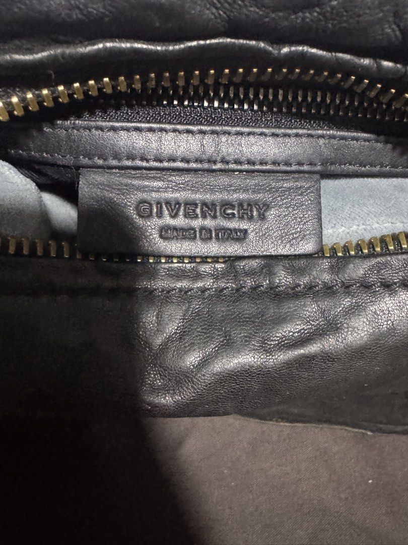 Givenchy Black Wrinkled Sheepskin Leather Pandora Bag without strap (Category: Luxury Bags & Wallets) located in Tarlac. Submitted by itsri1988 (Listing ID 1463493917, Image 3). Description: - Authentic Givenchy Pandora wrinkled sheepskin - Color: Black leather - Signature crumpled leather design - Gold-tone hardware - Multiple zip pockets for organization - Double top handles - Classic and versatile for everyday use - Shows some signs of wear on