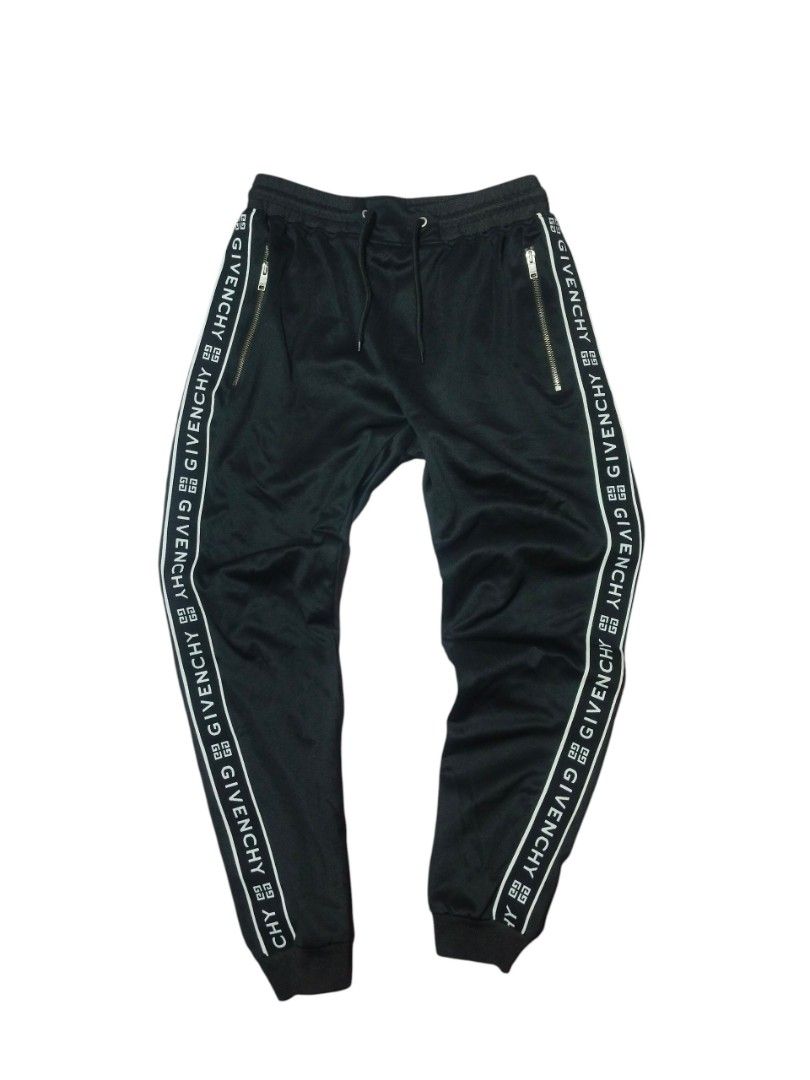 GIVENCHY PARIS LOGO TAPE TRACK PANTS🖤 (Category: Joggers) located in Cagayan de Oro. Submitted by thriftots (Listing ID 1466257779, Image 1). Description: GIVENCHY PARIS LOGO TAPE TRACK PANTS🖤 Brand: Givenchy Paris Size: S Color: Black Made in Portugal Condition: Good condition ✨ 📏 Measurements: • Length/Height: 36 inches • Width: 14 inches (waist) ✨ Features: • Givenchy logo tape on both sides • Givenchy Paris zipper • Zip pockets • Elastic w