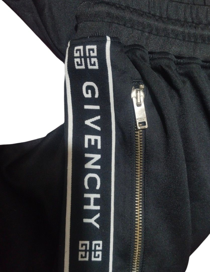 GIVENCHY PARIS LOGO TAPE TRACK PANTS🖤 (Category: Joggers) located in Cagayan de Oro. Submitted by thriftots (Listing ID 1466257779, Image 3). Description: GIVENCHY PARIS LOGO TAPE TRACK PANTS🖤 Brand: Givenchy Paris Size: S Color: Black Made in Portugal Condition: Good condition ✨ 📏 Measurements: • Length/Height: 36 inches • Width: 14 inches (waist) ✨ Features: • Givenchy logo tape on both sides • Givenchy Paris zipper • Zip pockets • Elastic w