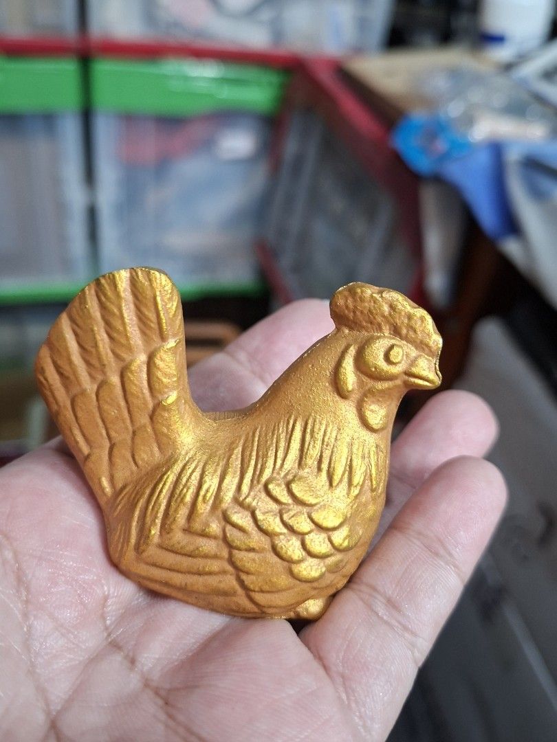 Gold Chicken Figurine Rooster Statue (Category: Figurines & Statues) located in Lucena. Submitted by dai_suki (Listing ID 1466305497, Image 3). Description: Gold chicken figurine. Detailed feathers all over the body with a prominent crest and tail. Flat base for standing upright on desks or shelves. Bright metallic gold finish. Small decorative piece, fits right in the palm of your hand. JAPAN SURPLUS SOURCE JRS COURIER ONLY 1ST TO PAY.