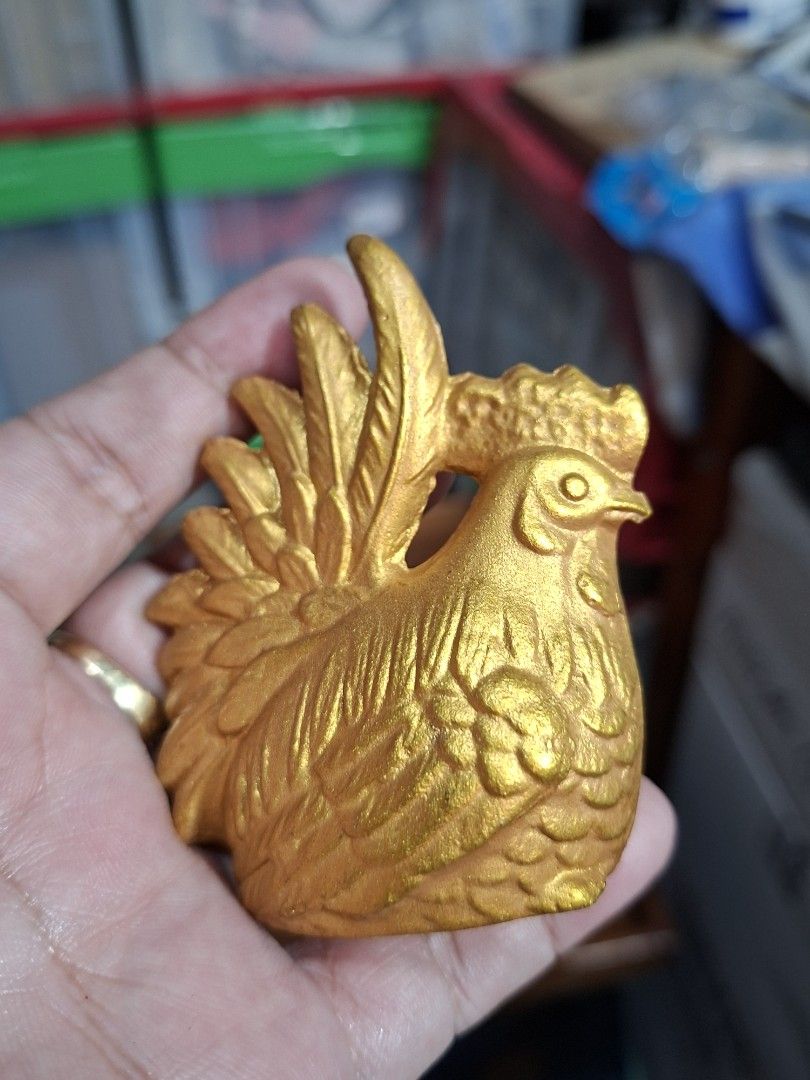 Gold Chicken Figurine Rooster Statue (Category: Figurines & Statues) located in Lucena. Submitted by dai_suki (Listing ID 1466305497, Image 2). Description: Gold chicken figurine. Detailed feathers all over the body with a prominent crest and tail. Flat base for standing upright on desks or shelves. Bright metallic gold finish. Small decorative piece, fits right in the palm of your hand. JAPAN SURPLUS SOURCE JRS COURIER ONLY 1ST TO PAY.
