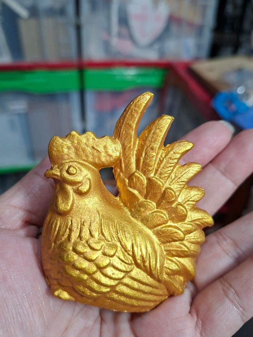 Gold Chicken Figurine Rooster Statue (Category: Figurines & Statues) located in Lucena. Submitted by dai_suki (Listing ID 1466305497, Image 1). Description: Gold chicken figurine. Detailed feathers all over the body with a prominent crest and tail. Flat base for standing upright on desks or shelves. Bright metallic gold finish. Small decorative piece, fits right in the palm of your hand. JAPAN SURPLUS SOURCE JRS COURIER ONLY 1ST TO PAY.