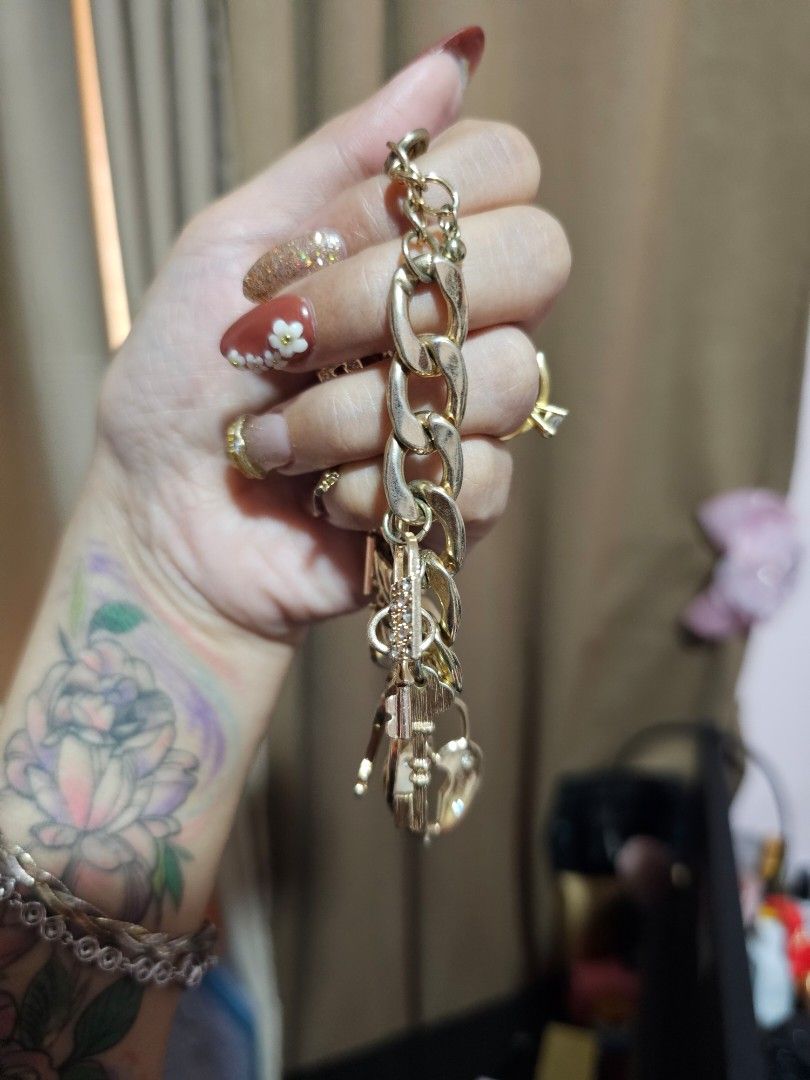 Gold tone charm studded bracelet (Category: Bracelets) located in Angeles City. Submitted by kodachi10 (Listing ID 1466184262, Image 1). Description: pretty charm bracelet adjustable. fits small to large wrists.