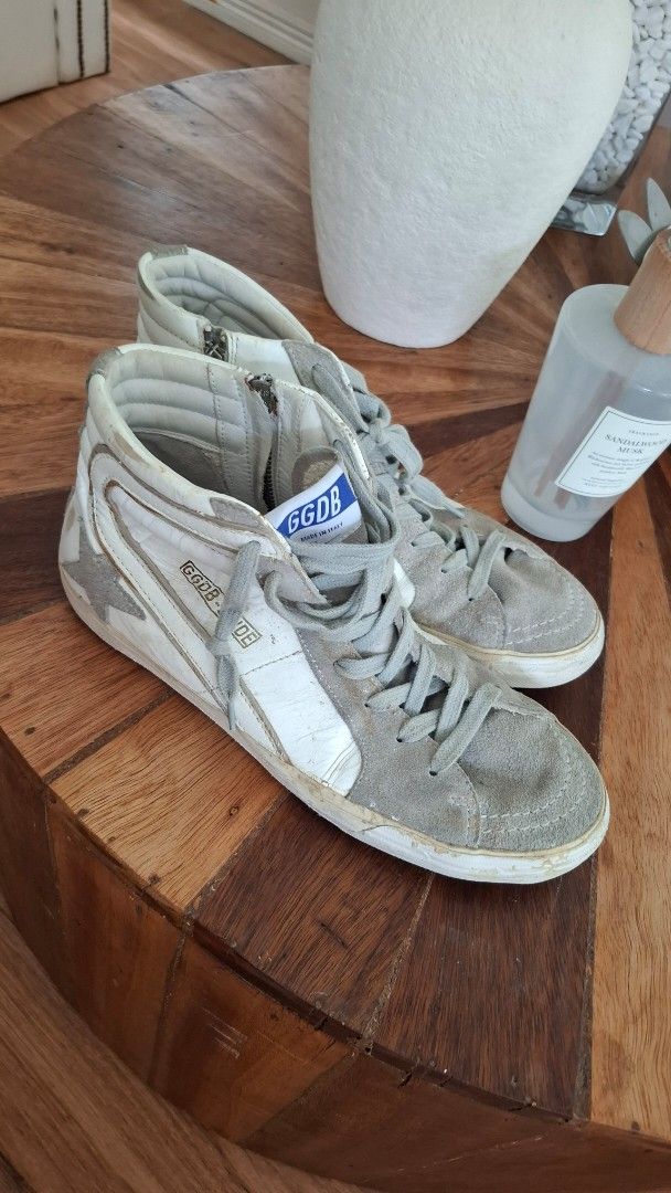 Golden Goose Slide High Top Sneakers (Category: Sneakers & Footwear) located in Quezon City. Submitted by gyari (Listing ID 1466219829, Image 1). Description: 100% authentic bought in uk used twice - Brand: Golden Goose Deluxe Brand - Model: Slide High Top Sneakers - Colorway: White leather with grey suede toe panels - Details: Iconic side star, lace-up closure with convenient side zipper, GGDB tongue tag, and black SLIDE branded insoles - Finish