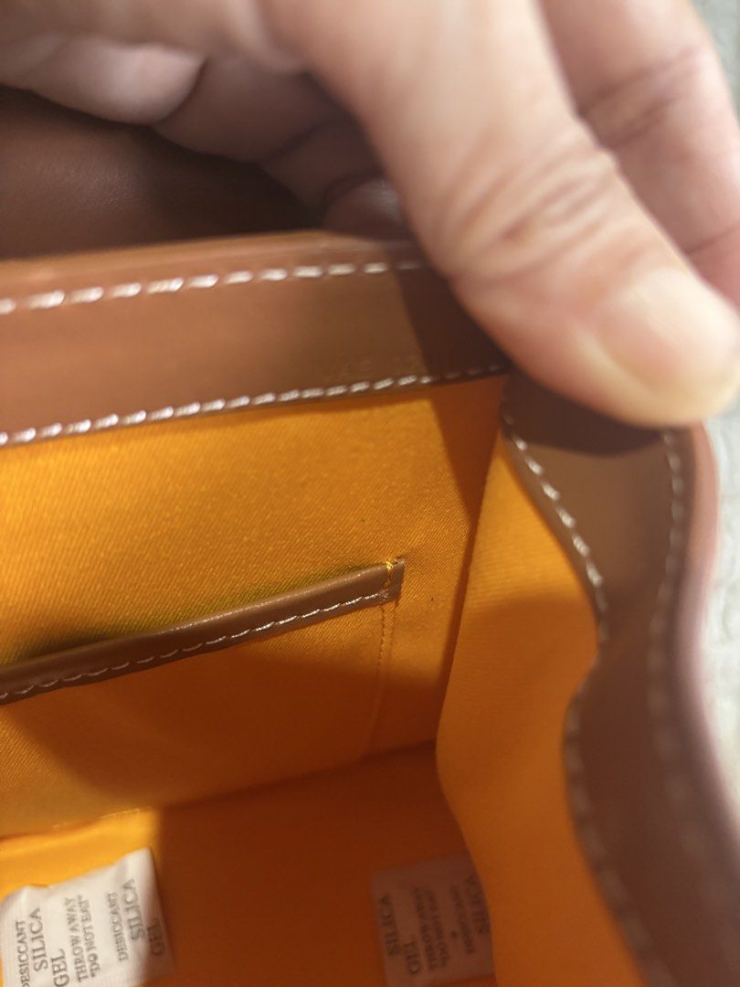 Goyard Saigon Structured Top Handle Bag (Category: Luxury Bags & Wallets) located in Rizal. Submitted by riri.rarapreloved (Listing ID 1466241064, Image 2). Description: - Goyard Saigonsignature chevron canvas with tan leather trim - Features a luxury wooden top handle and secure flip-lock front closure with leather flap detail - Vibrant yellow fabric interior with a convenient slip pocket - Includes a detachable shoulder strap for versatile styl