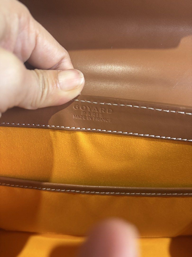 Goyard Saigon Structured Top Handle Bag (Category: Luxury Bags & Wallets) located in Rizal. Submitted by riri.rarapreloved (Listing ID 1466241064, Image 3). Description: - Goyard Saigonsignature chevron canvas with tan leather trim - Features a luxury wooden top handle and secure flip-lock front closure with leather flap detail - Vibrant yellow fabric interior with a convenient slip pocket - Includes a detachable shoulder strap for versatile styl